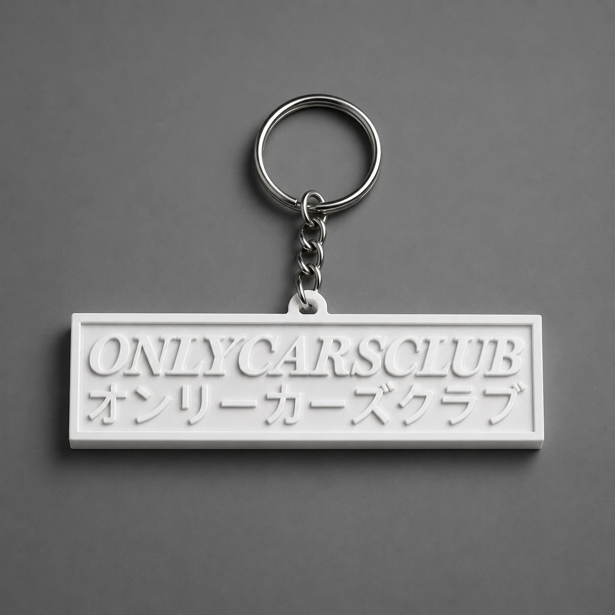 Chaveiro com logotipo branco do Only Cars Club